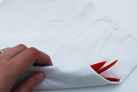 Wrap plastic utensils in a premium paper napkin folded into quarters and 