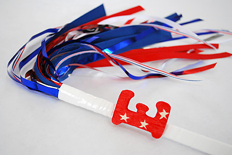 Merriment :: Sparkless sparklers for kids for the Fourth of July  using chopsticks, ribbon and party garland free DIY tutorial craft  project for Merriment Design by Kathy Beymer at MerrimentDesign.com