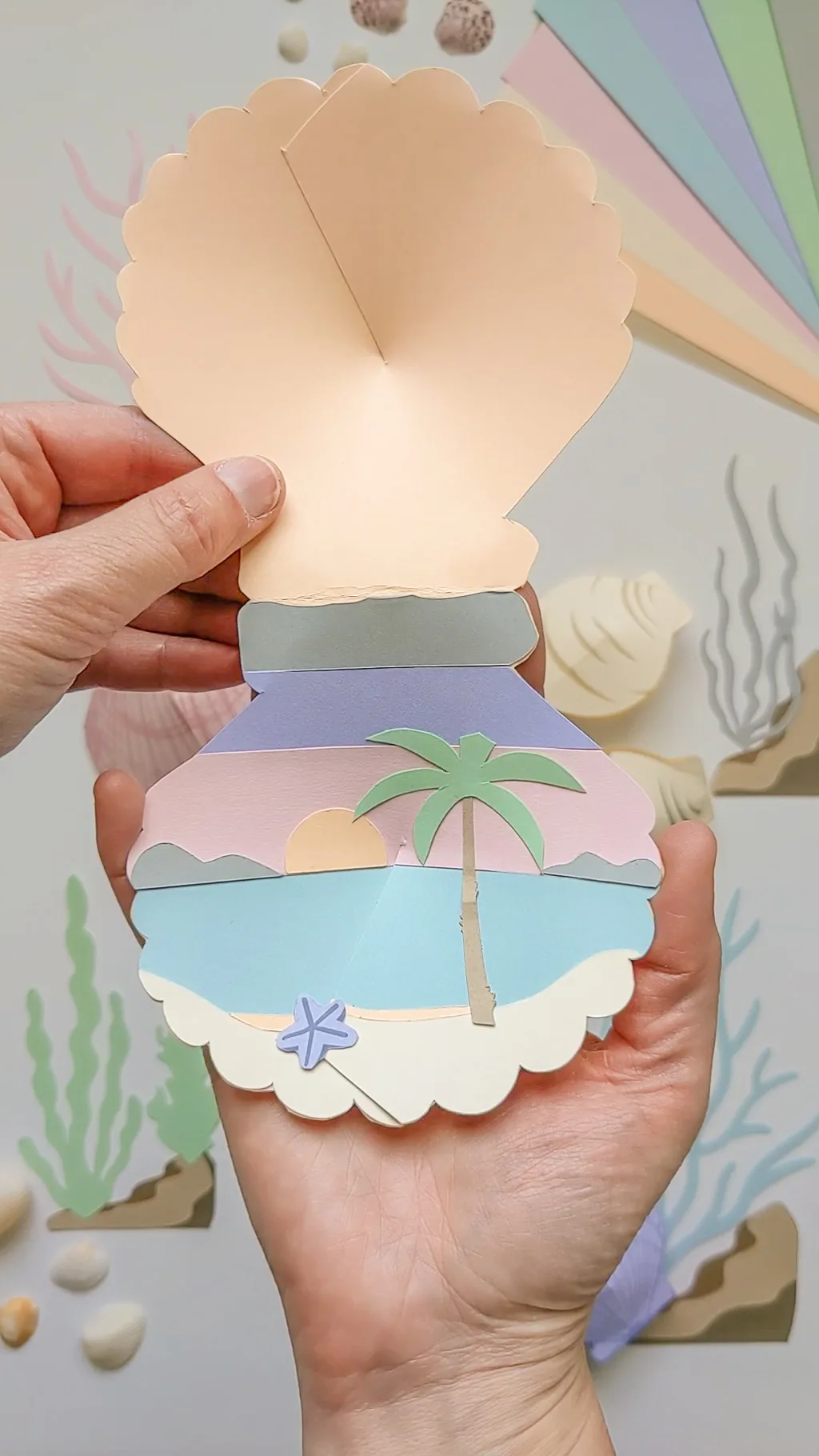 3D paper seashell craft with hidden sunset beach scene inside