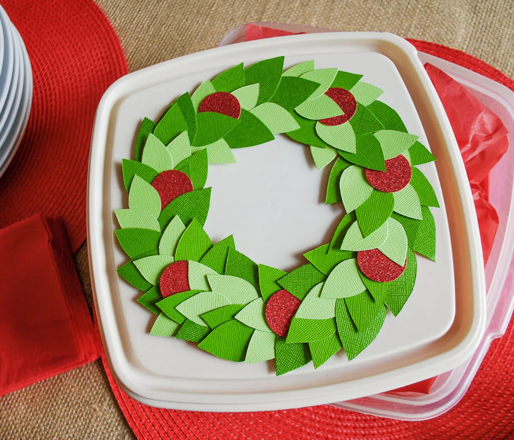 Cute cookie exchange idea: Decorate the lids of your cookie gifts and cookie exchange tupperware. It's easy to remove to wash and re-use next year. #christmas #diy #handmade #christmascookies #cookies #cookieexchange #diygifts