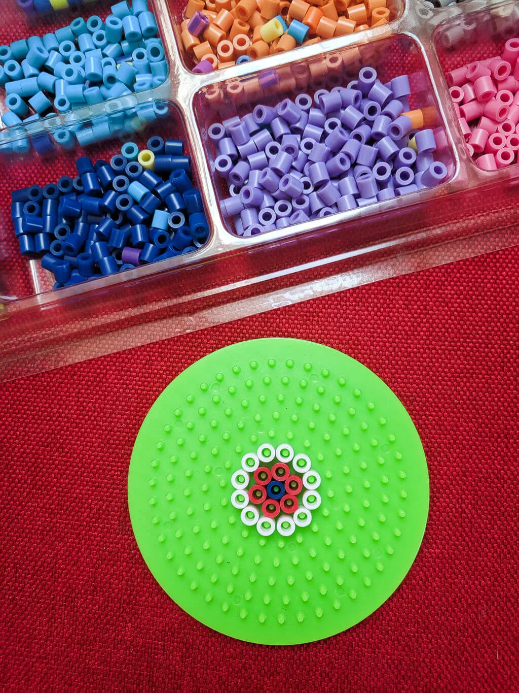 Perler beads in a circle on a circle plate.