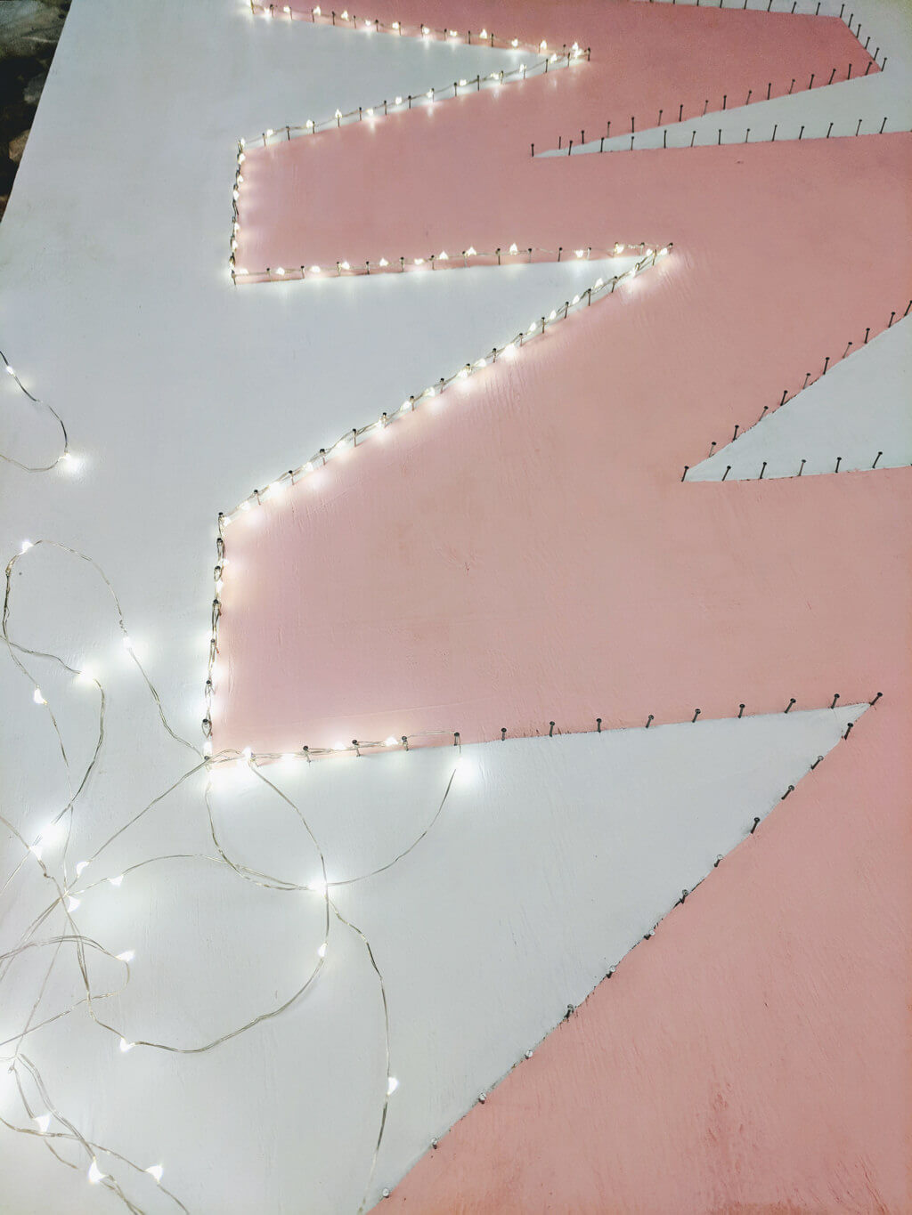 Wrapping lights on nails for a lighted sign