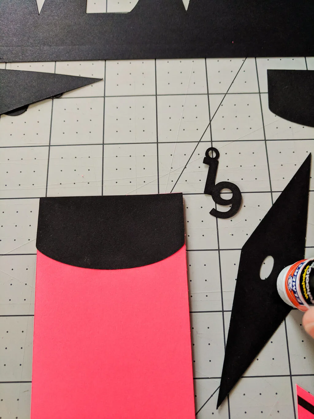 Gluing paper graduation cap onto a graduation bookmark