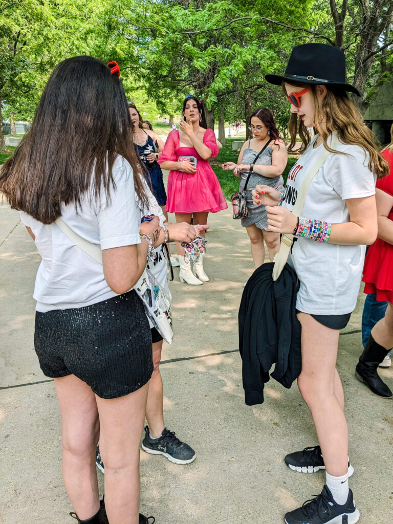 Trading bracelets at the Taylor Swift Concert at Soldier Field. Copyright 2023 Merriment Design Co. Please contact me for written permission before sharing this photo.