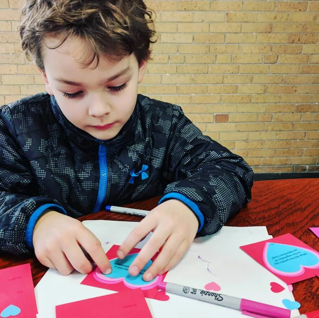 Liam making valentines copyright Kathy Beymer