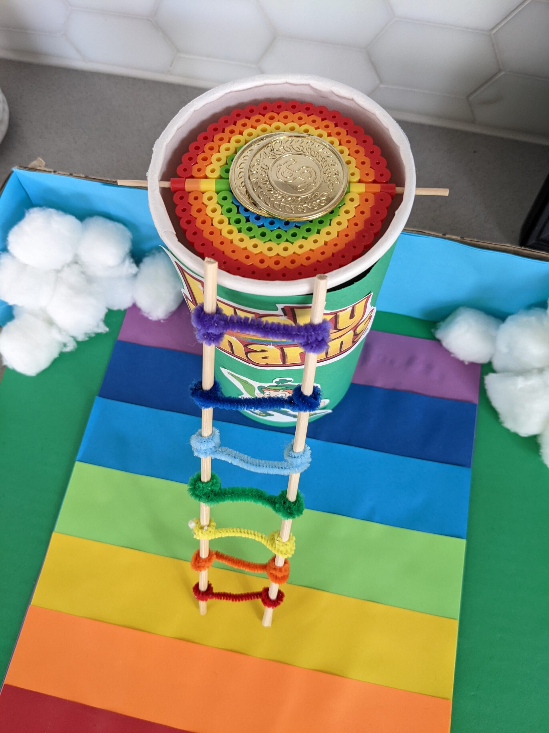 Leprechaun trap with a rainbow ladder and rainbow trap door