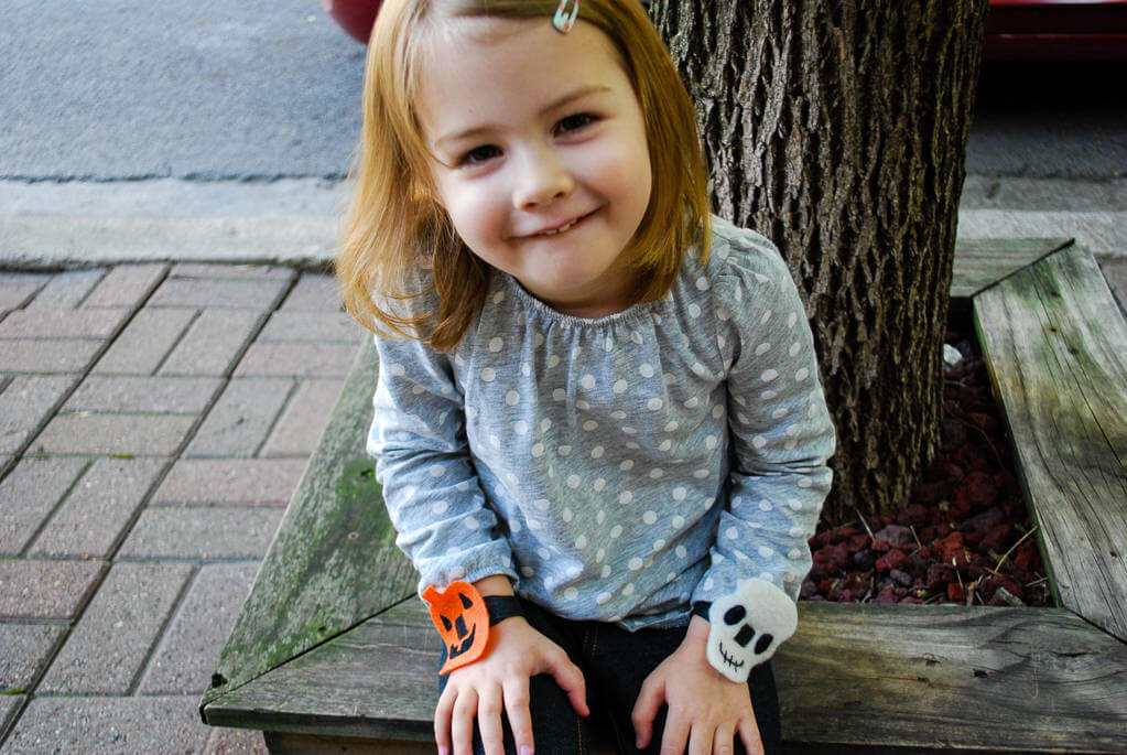 Elise wearing felt Halloween bracelets. Copyright Merriment Design Co. Do not use without written permission.