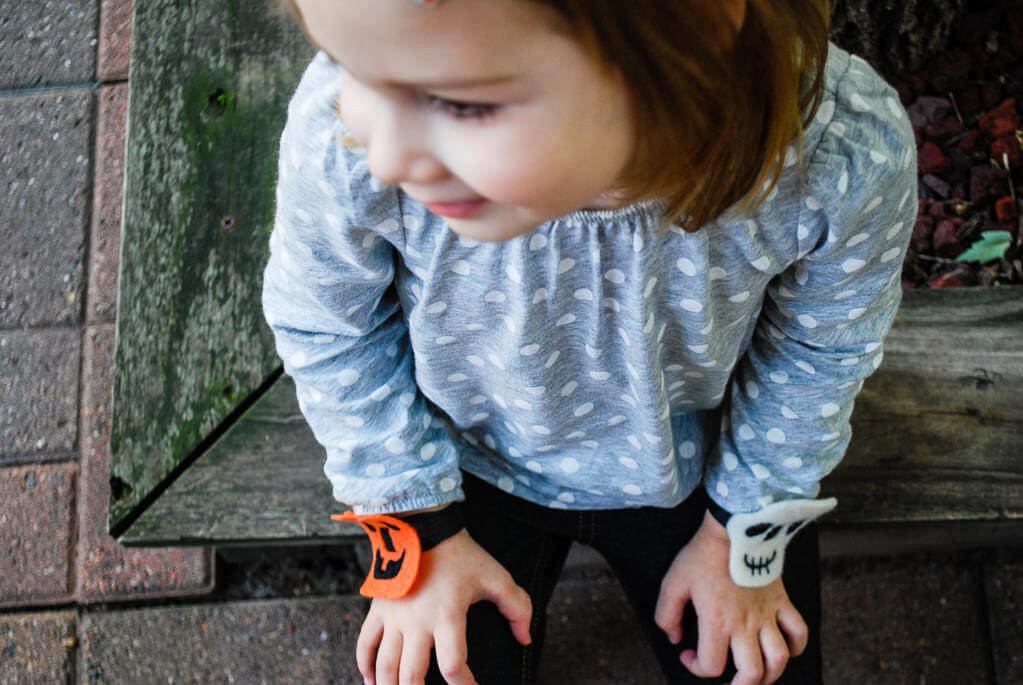 Elise wearing felt Halloween bracelets. Copyright Merriment Design Co. Do not use without written permission.