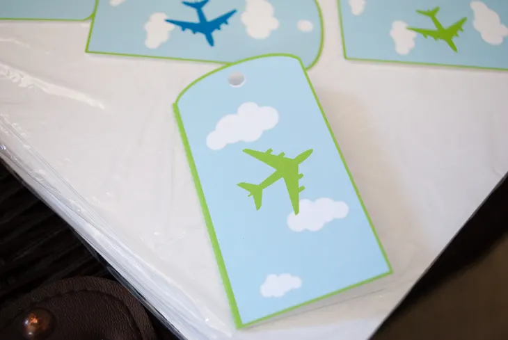 Printable personalized airplane favor bag (goodie bag) luggage tags for an airplane birthday party. Just type to personalize for party guests, print, cut out and tie onto your goodie/favor bags. What a cute and easy airplane birthday party favor bag idea!