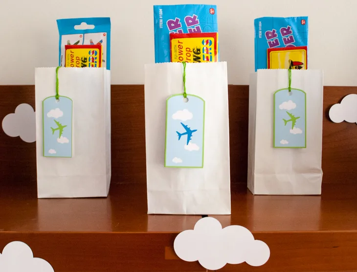 Printable personalized airplane favor bag (goodie bag) luggage tags for an airplane birthday party. Just type to personalize for party guests, print, cut out and tie onto your goodie/favor bags. What a cute and easy airplane birthday party favor bag idea!