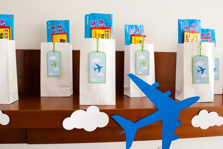 Printable personalized airplane favor bag (goodie bag) luggage tags for an airplane birthday party. Just type to personalize for party guests, print, cut out and tie onto your goodie/favor bags. What a cute and easy airplane birthday party favor bag idea!