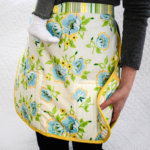 Free apron sewing pattern with built-in potholders and iPhone pocket