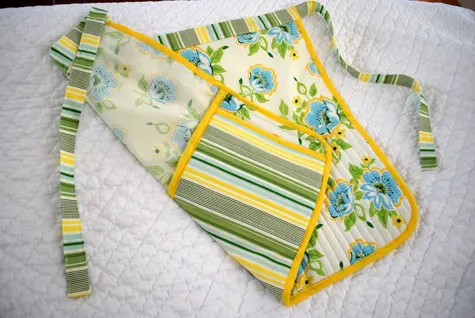 Free apron sewing pattern with built-in potholders and secret iPhone pocket