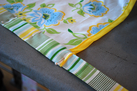 Free apron sewing pattern with built-in potholders and secret iPhone pocket