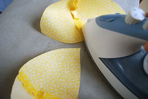 Ironing a baby hat brim