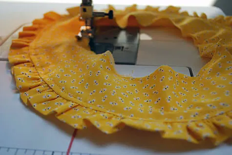 Sewing a baby bonnet with ruffles
