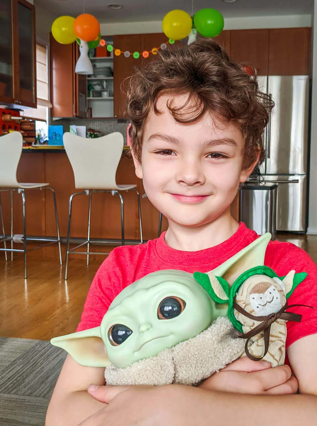 Liam with Baby Yoda doll. Copyright Merriment Design Co. Do not use without written permission.