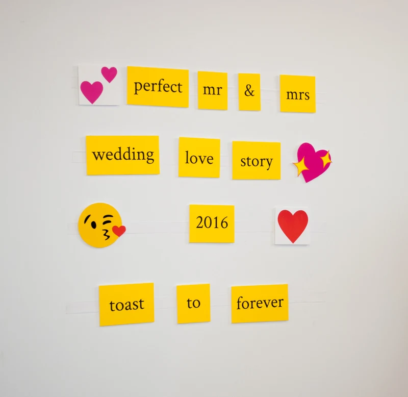 Best Wedding Wishes DIY Photo Booth Backdrop. Give wedding guests word tiles and emojis to spell their best wishes. Removes cleanly and easily from walls - no damage! What an easy and clever DIY photobooth and guest book idea!