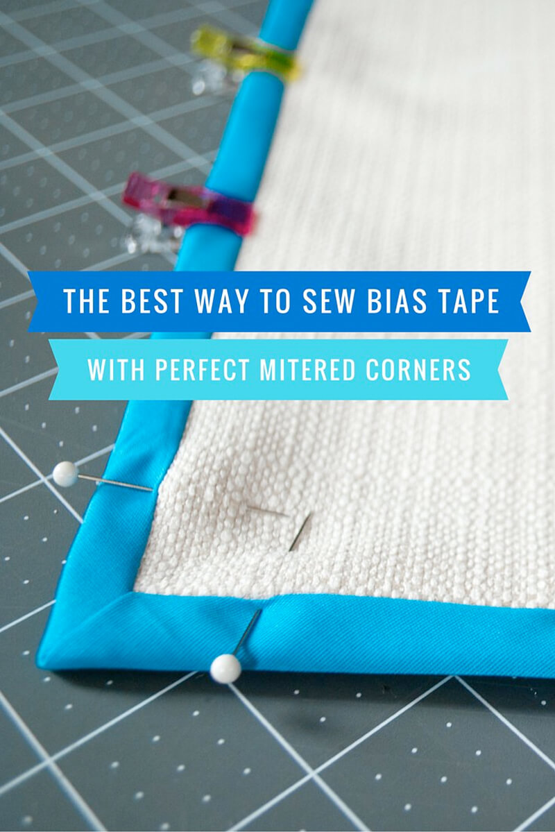Here's the best and easiest way to sew bias tape with mitered corners. Includes detailed step-by-step photos plus a video! Try this easy method and you'll sew pretty, perfect mitered corners with double fold bias tape.