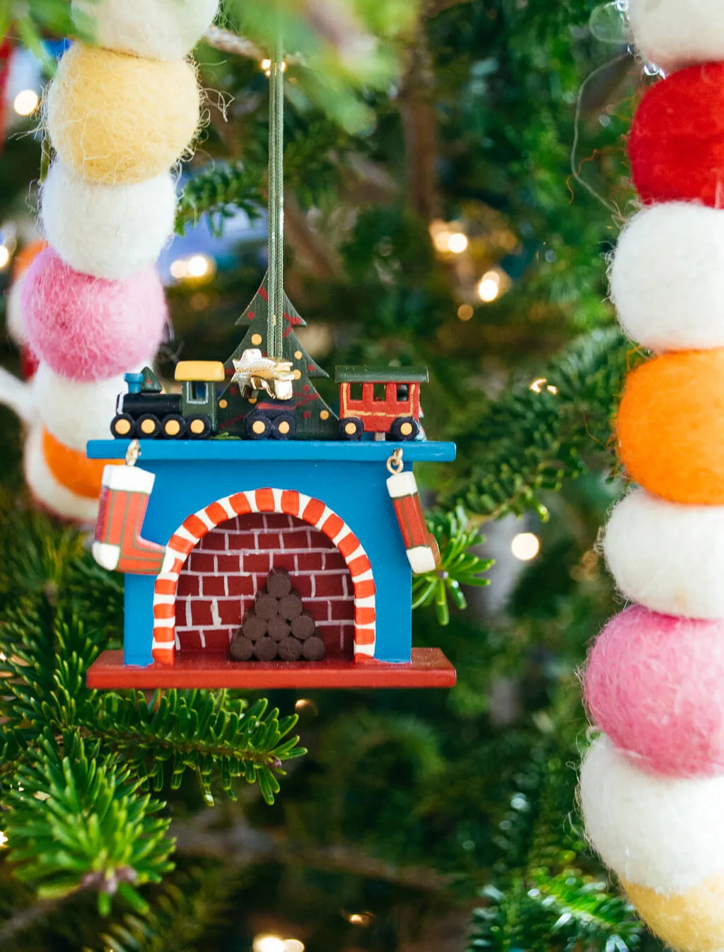 Wooden fireplace German Christmas ornament with trains and stockings #christmas #christmasornament #german