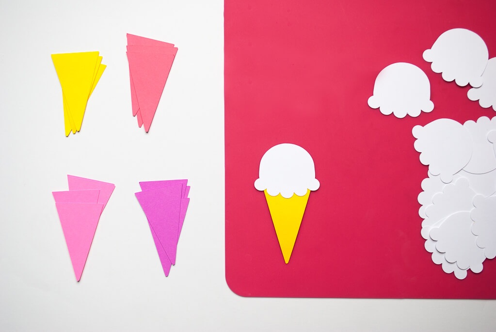 Paper ice cream cones banner in yellow, pink and purple