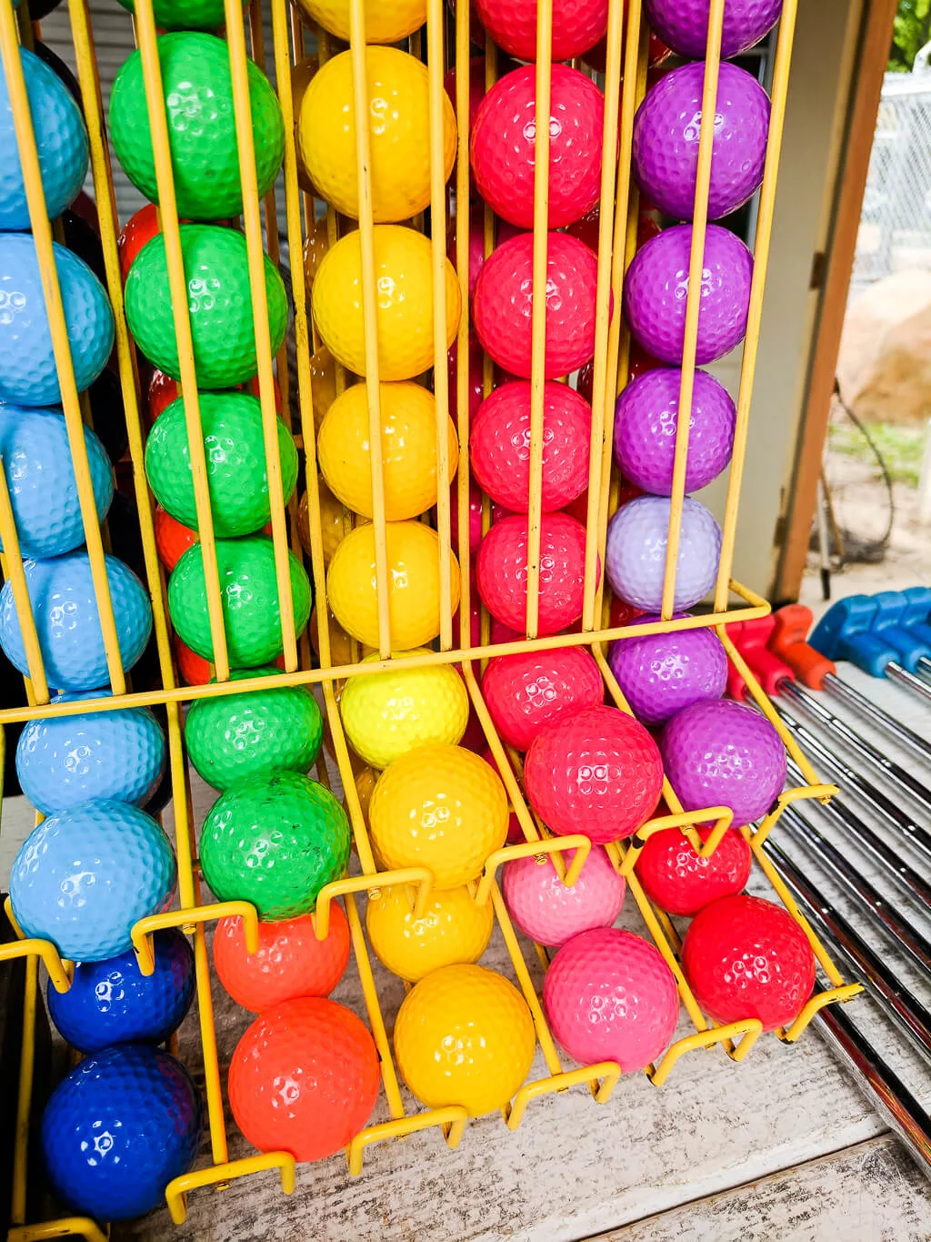 Colorful miniature golf balls in a rainbow of colors