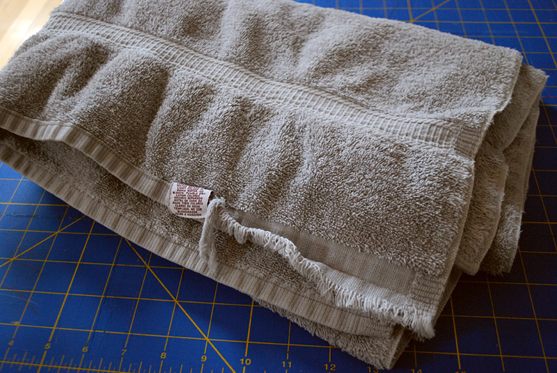 DIY curved baby burp cloth free sewing pattern and tutorial. Upcycle old towels or use your own fabric to make these comfortable curved burp cloths.