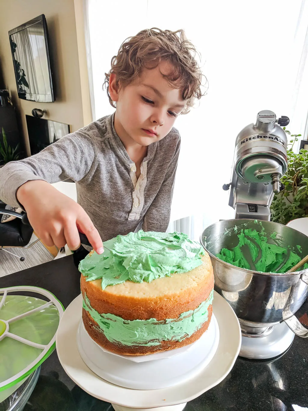 Icing a dinosaur cake