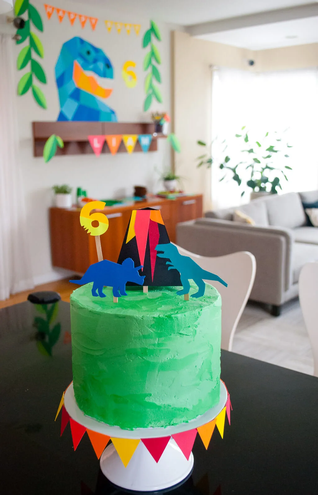 How to make an easy dinosaur cake with dinosaur and volcano toppers Easy DIY dinosaur cake for a dinosaur birthday party