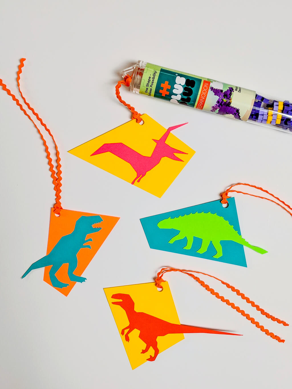 Paper dinosaur favor tags with free printable template