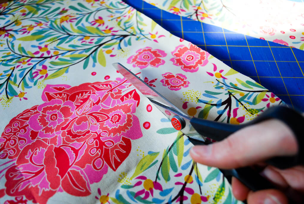 Cutting fabric with scissors