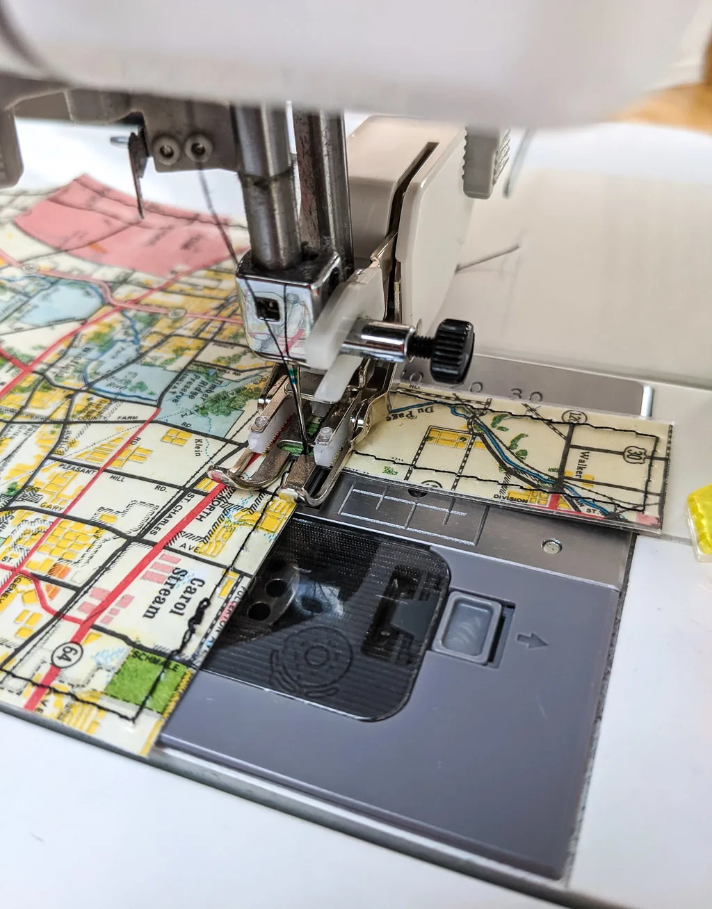 Sewing a DIY card holder from paper maps and clear contact paper