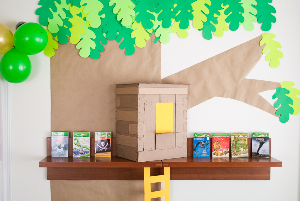 DIY Cardboard & Paper Magic Tree House Birthday Party Decoration. It's easy to recycle cardboard boxes into fun magic tree house birthday party decor for the food table.