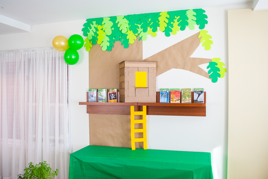 DIY Cardboard & Paper Magic Tree House Birthday Party Decoration. It's easy to recycle cardboard boxes into fun magic tree house birthday party decor for the food table.