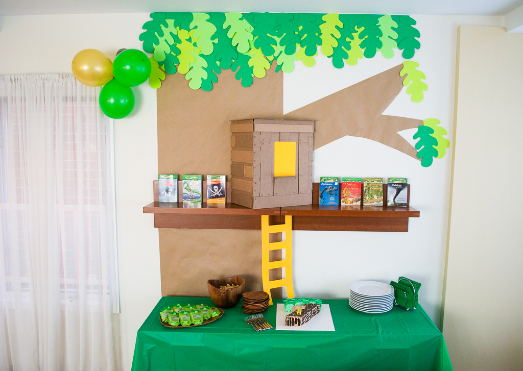 DIY Cardboard & Paper Magic Tree House Birthday Party Decoration. It's easy to recycle cardboard boxes into fun magic tree house birthday party decor for the food table.