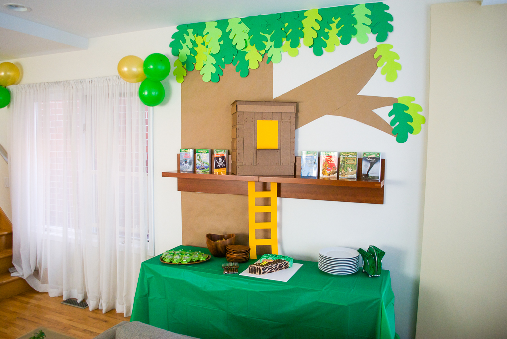 DIY Cardboard & Paper Magic Tree House Birthday Party Decoration. It's easy to recycle cardboard boxes into fun magic tree house birthday party decor for the food table.