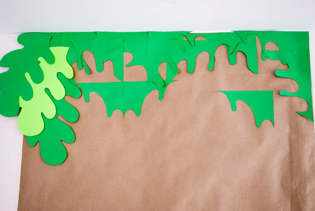 DIY Cardboard & Paper Magic Tree House Birthday Party Decoration. It's easy to recycle cardboard boxes into fun magic tree house birthday party decor for the food table.