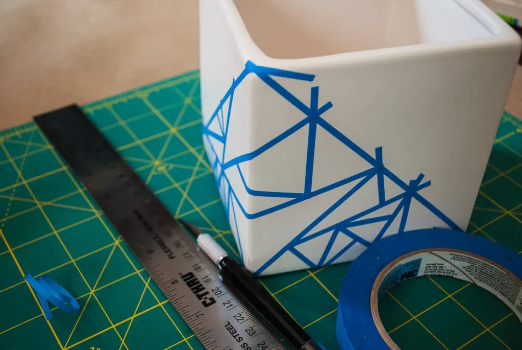 Plant pot with painter's tape to make triangles