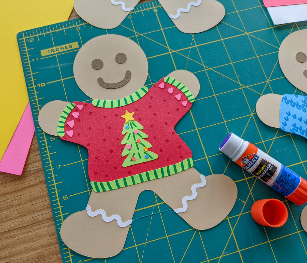 Paper DIY gingerbread garland wearing ugly Christmas sweaters
