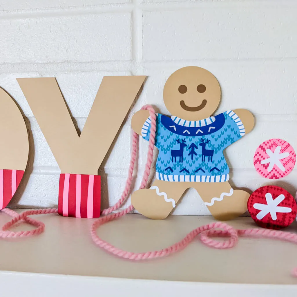Paper gingerbread man wearing ugly sweater