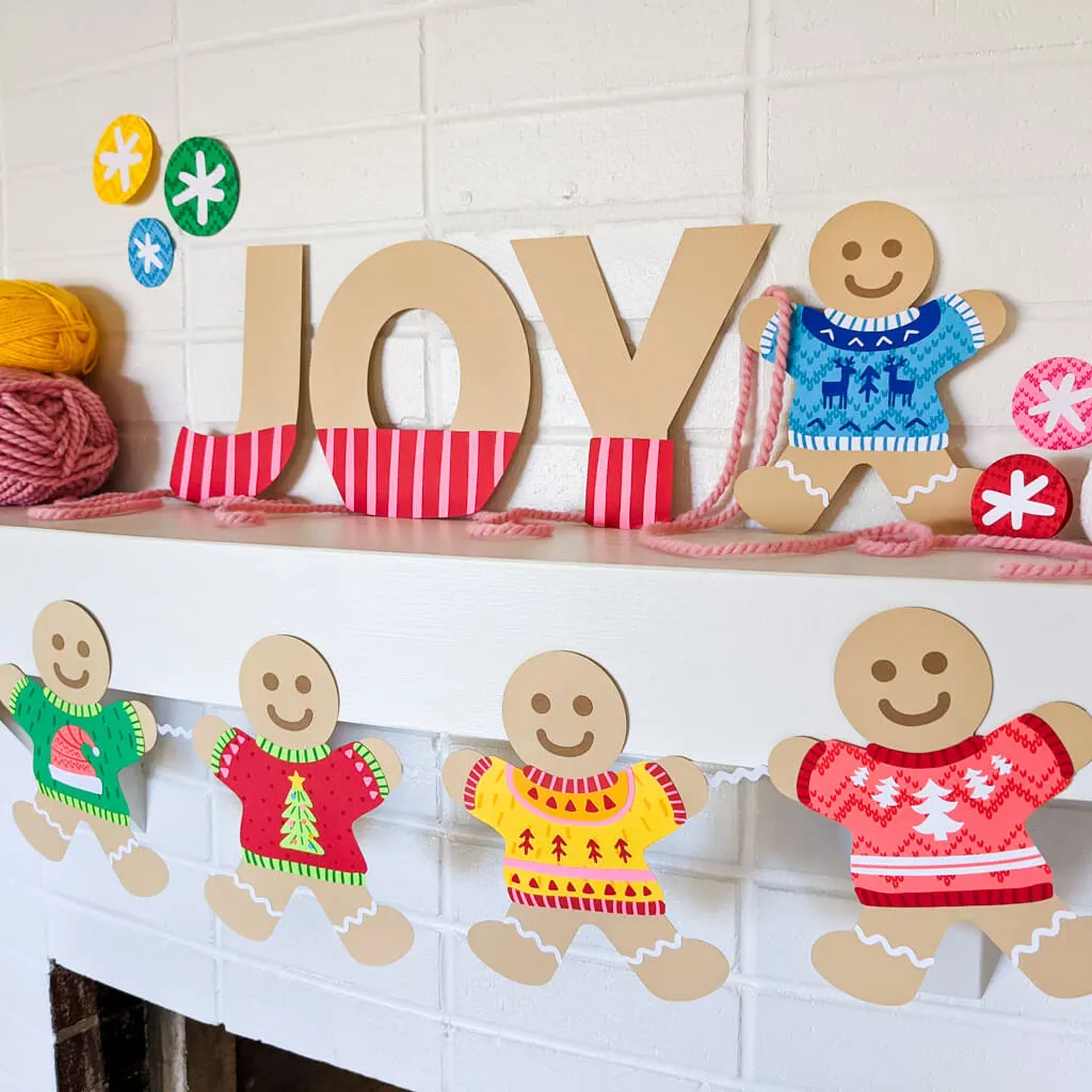 Gingerbread Christmas decor DIY on the fireplace mantle wearing paper ugly sweaters