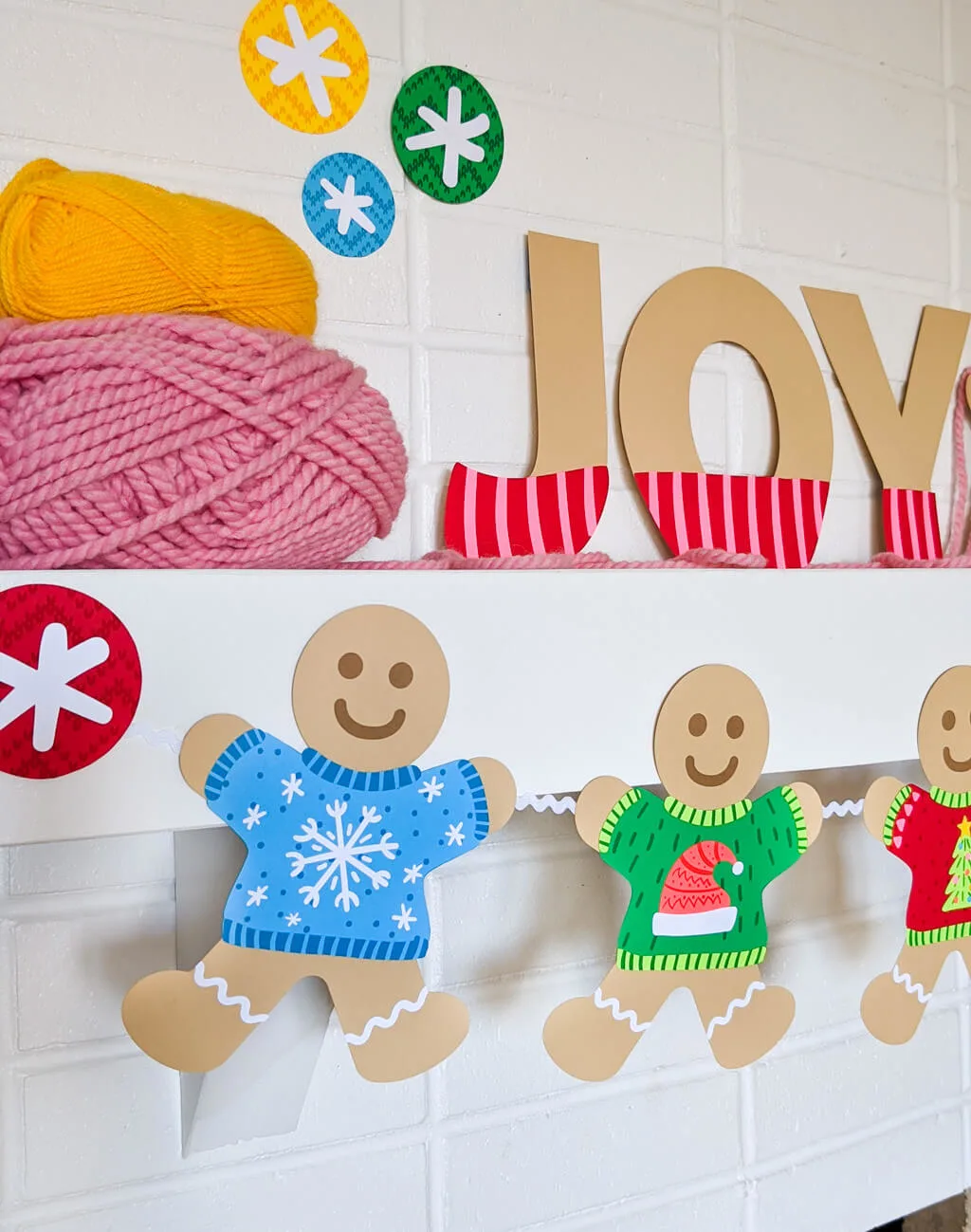 Paper ugly sweater garland with gingerbread pals