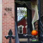 Easy DIY Halloween front door decoration: Subtle spiderwebs