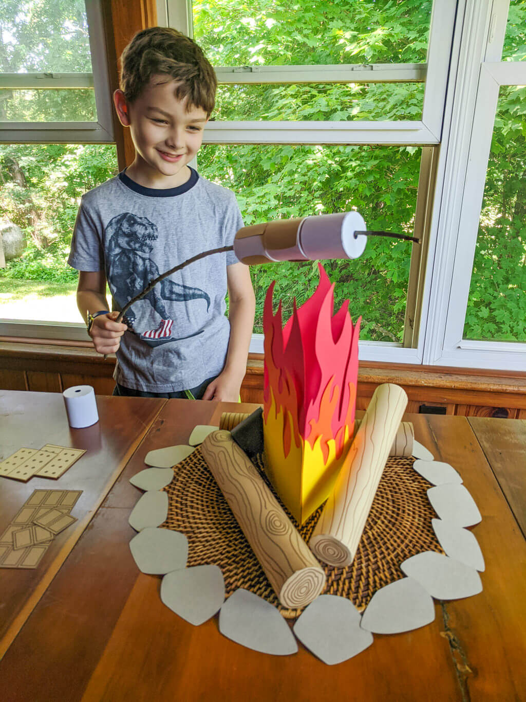 Liam playing pretend with campfire play set Copyright Merriment Design. Do not distribute without written permission.