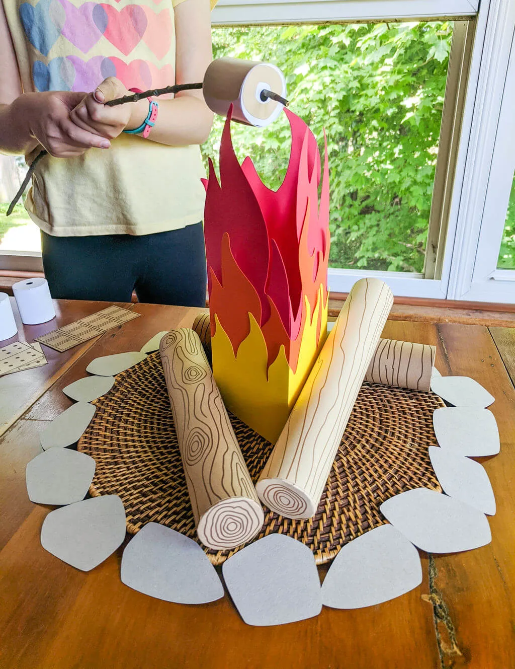 Kid playing with pretend campfire and s'mores DIY play set craft