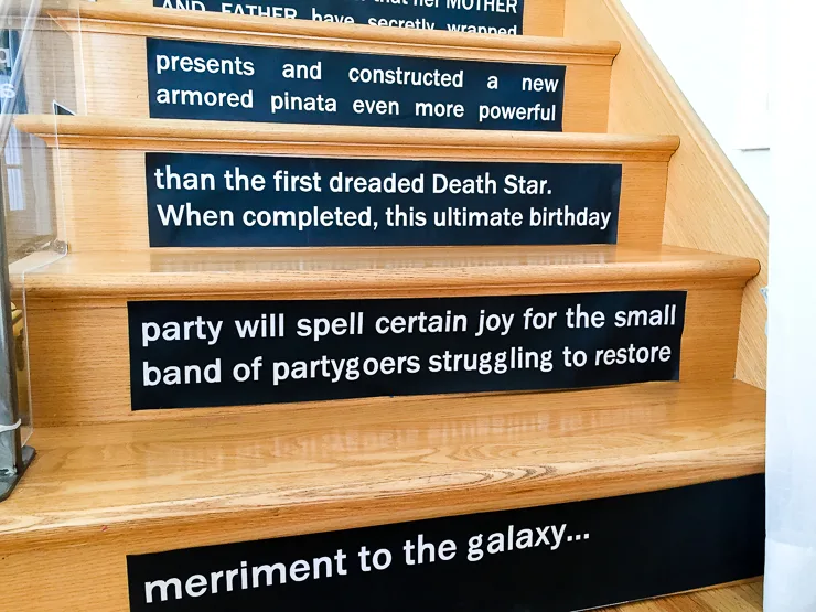 Make a DIY Star Wars opening crawl on stair risers - such a fun decoration for Star Wars birthday party