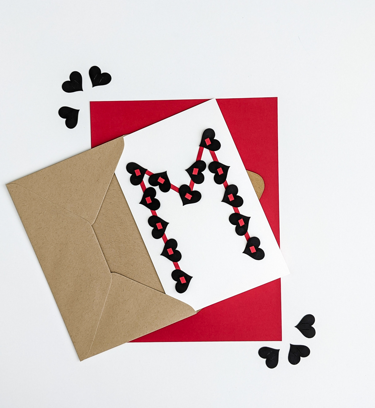 Putting a DIY Valentine's Day card into an envelope