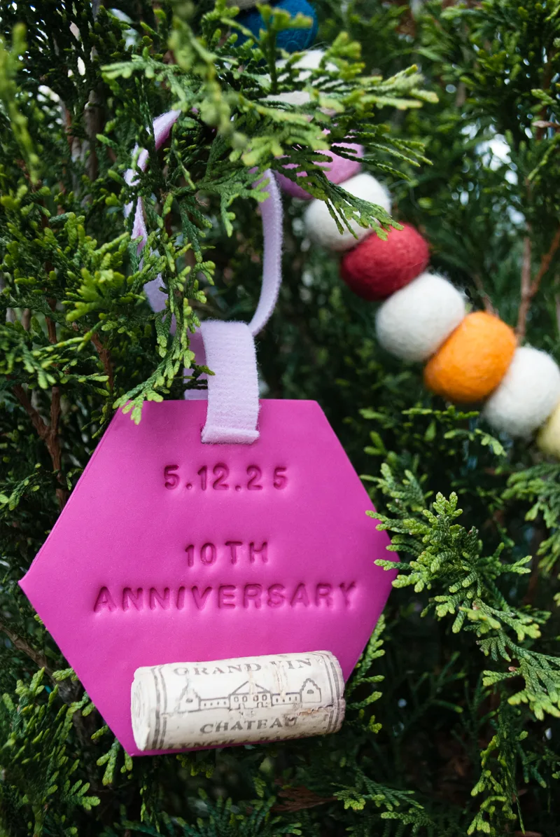 DIY wedding gift: Wine tags that transform into Christmas ornament keepsakes. Stock the newlywed's wine fridge with bottles to enjoy together on their future anniversaries. Make wine tags and attach using VELCRO® Brand fasteners. After each anniversary, they become keepsake Christmas ornaments! Attach saved corks to tags using VELCRO® Brand fasteners and hang them on the Christmas tree with VELCRO® Brand ONE-WRAP® Ties. #spon