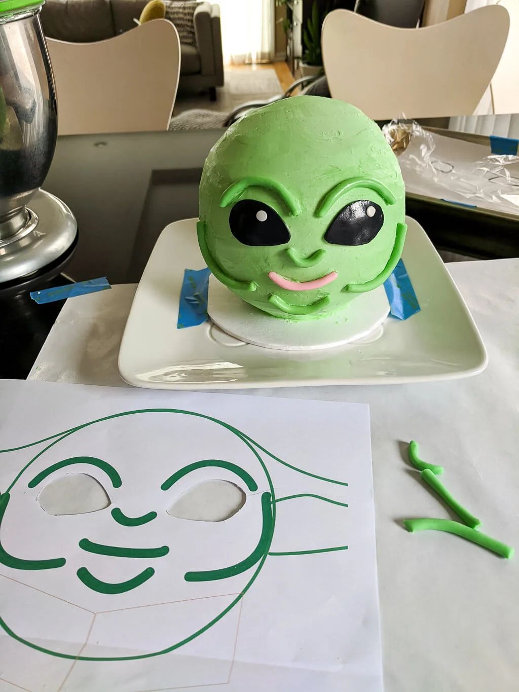 DIY Baby Yoda cake with buttercream icing and fondant accents