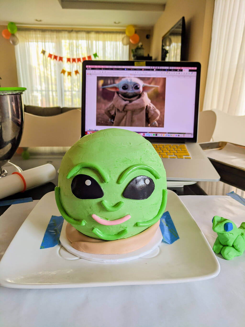 Making a DIY Baby Yoda cake with printable ears